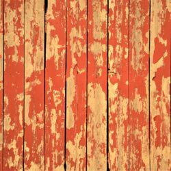 Peeling red barn wall